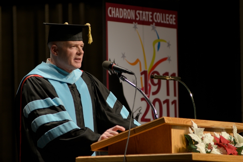 Dr. Timothy Anderson delivers the commencement address during Chadron State College's ceremony for master's degree recipients.