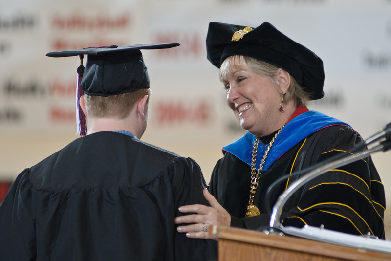 Chadron State College President Janie Park greets a graduate during the December 2011 commencement ceremonies. This will be the final graduation ceremonies conducted by Park and Vice President of Academic Affairs Lois Veath, who are both retiring this year. (Photo by Daniel Binkard)