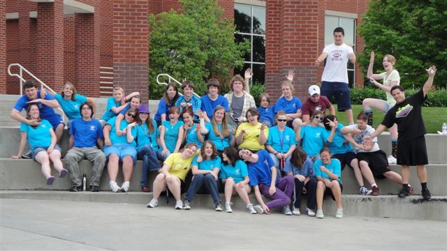 Upward Bound participants from 2010 gather with Chadron State College student leaders at the base of the Lindeken Clock Tower. (CSC Photo)