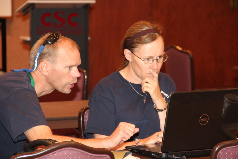 Incident Management Team members Jeff Hickerson of Santa Fe, N.M., and Darby Frank of Shoshoni, Wyo., work in the Chadron State College Student Center on Thursday. (Photo by Justin Haag)