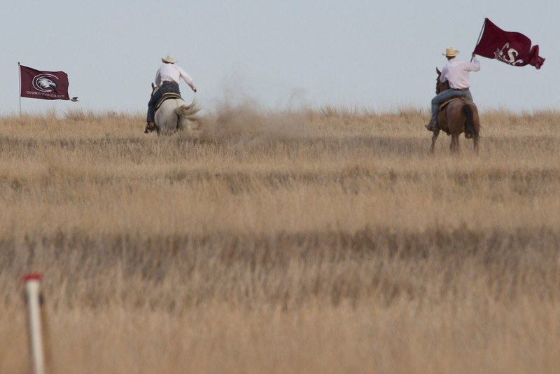 Chadron State College rodeo club members Bridger and Collin Chytka charge the hill to show people where the Rangeland Complex will be constructed. (Photo by Justin Haag)