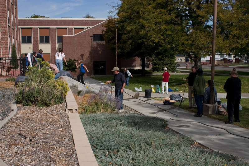 Volunteers of the Chadron State College Arboretum work during an effort to plant boxwoods, daisies and daffodils near Edna Work Hall in October 2011. (Photo by Dewayne Gimeson)