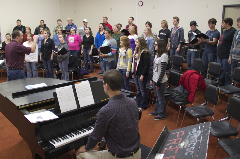 The Chadron State College Concert Choir rehearses Oct. 17 with director Joel Schreuder and accompanist Brooks Hafey. (Photo by Justin Haag)