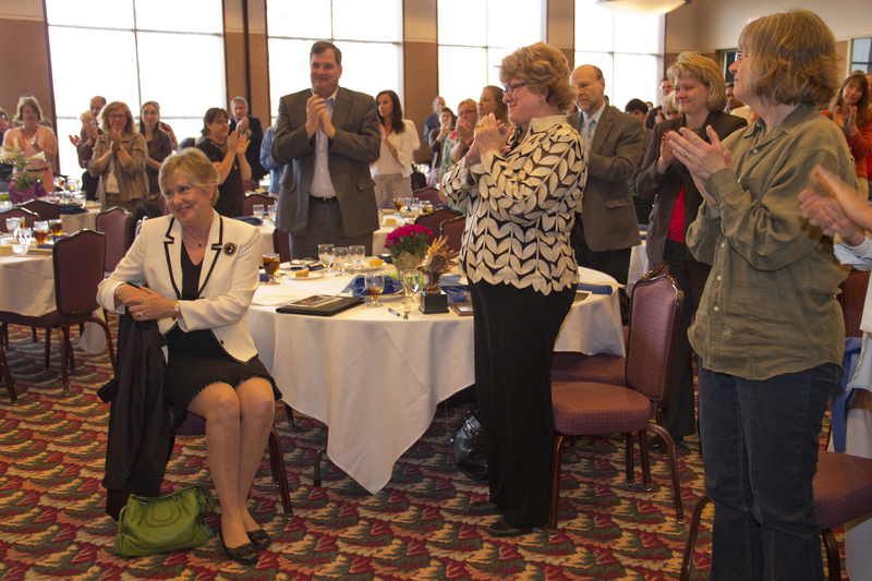 Those attending Chadron State College's annual faculty-staff recognition luncheon applaud CSC President Janie Park, who announced her intent to retire May 11. (Photo by Justin Haag)