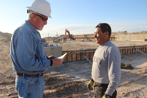 Craig Hadan consults with Angel Padilla