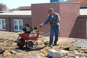 The roof of Edna Work Wing being removed