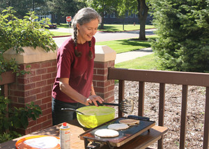 Una Taylor flips pancakes