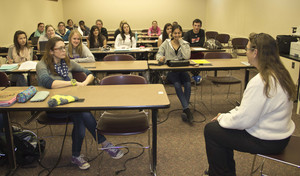 Connie Moore demonstrates to her class