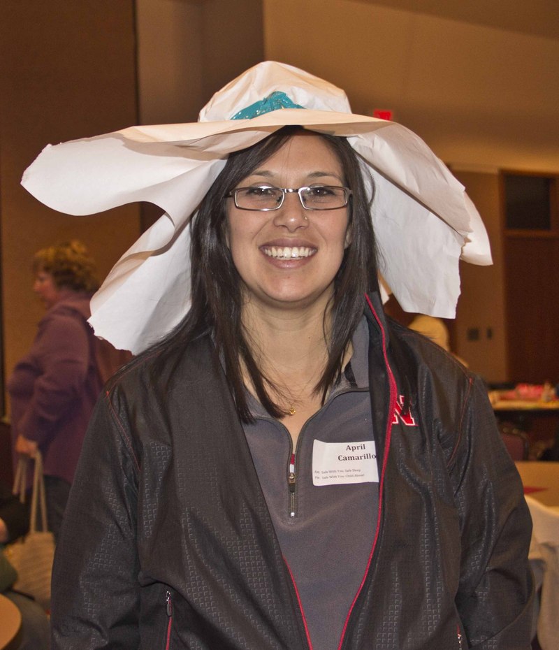 April Camarillo, Scottsbluff, wears a hat made from paper and duct tape by conference keynote speaker Patricia Dischler during the 25th annual Excellence in Early Childhood Conference at Chadron State College.