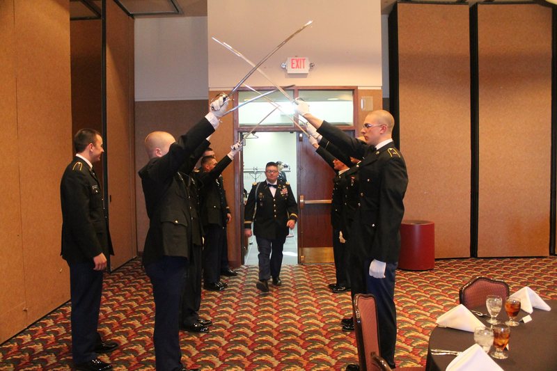 Mount Rushmore Battalion Army ROTC cadets perform the Saber Arch at the Military Ball on the Chadron State Campus March 29. The arch is a tradition to honor cadets who will soon commission as 2nd Lts.