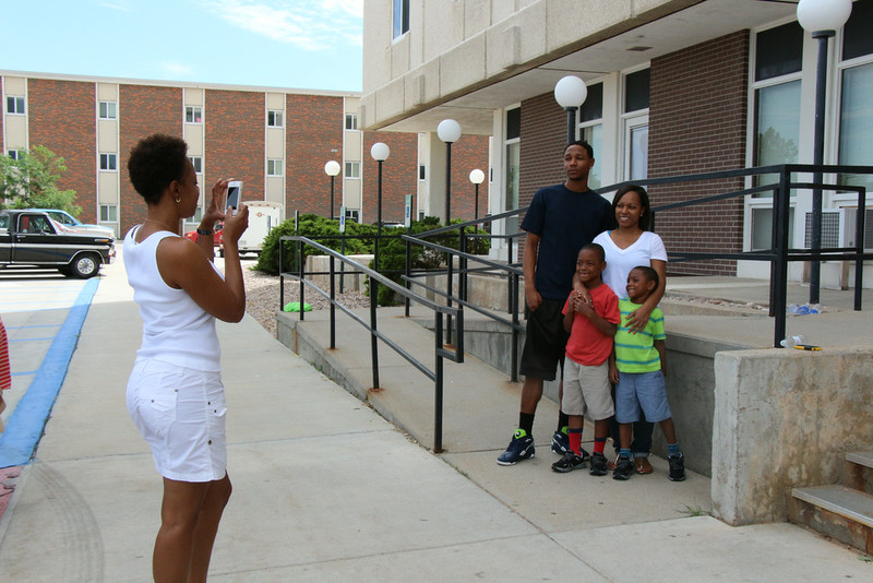 The family of Chadron State College sophomore Jordan Smith takes a break from moving him into Highrise Thursday to pose for a photo. From left, Rhonda Smith, taking photo, back row, Jordan Smith and Jacqueline Smith.