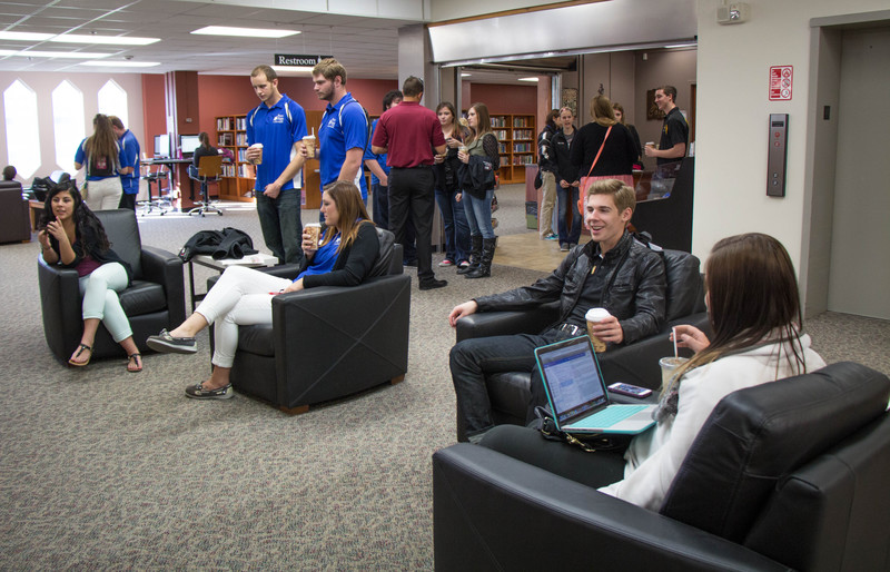 Students leaders from Chadron State College, Peru State College and Wayne State College relax near the coffee shop in the Library Learning Commons during their campus tour Friday. (Tena L, Cook/Chadron State College)