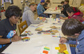 CSC student Quenita Green, left, assists in a watercolor class during CSC Art Day 2013. (Tena L. Cook/Chadron State College)