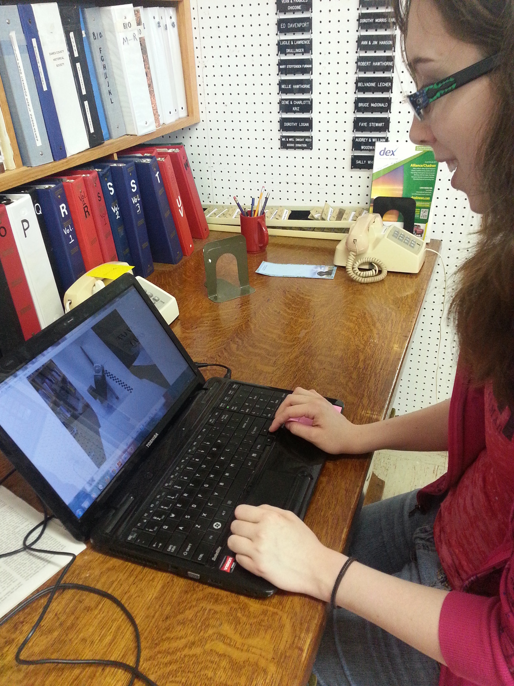 Chadron State College student Misty Dickey, Worland, Wyo., documents historical objects at the Dawes County Museum as part of the History Harvest project being conducted by the History 465/Processes in North American West taught by Dr. David Nesheim this semester.