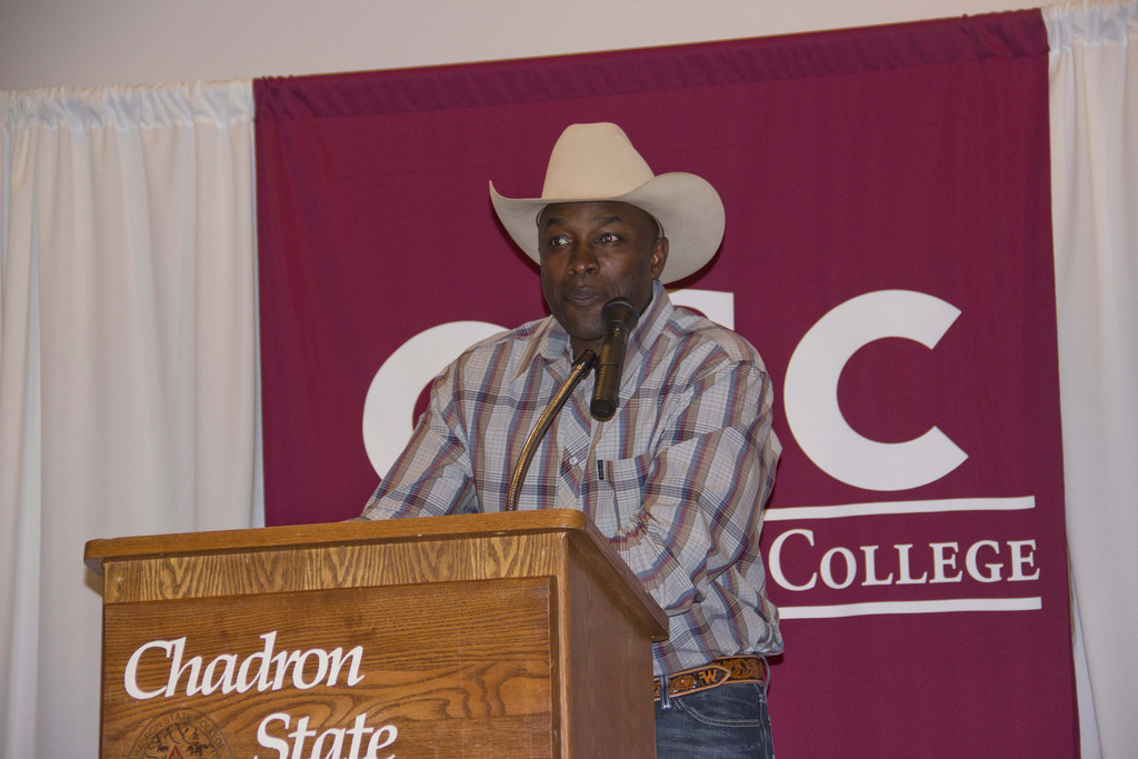 Fred Whitfield, eight-time world champion calf roper, speaks at the Student Center Thursday night.