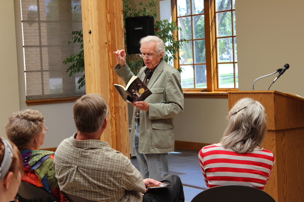 Nebraska Public Television pioneer Ron Hull, center, reads an excerpt from his book, 'Backstage' to an audience at the closing session of the Story Catcher Summer Writing Workshop and Festival at the Mari Sandoz High Plains Heritage Center on Friday.