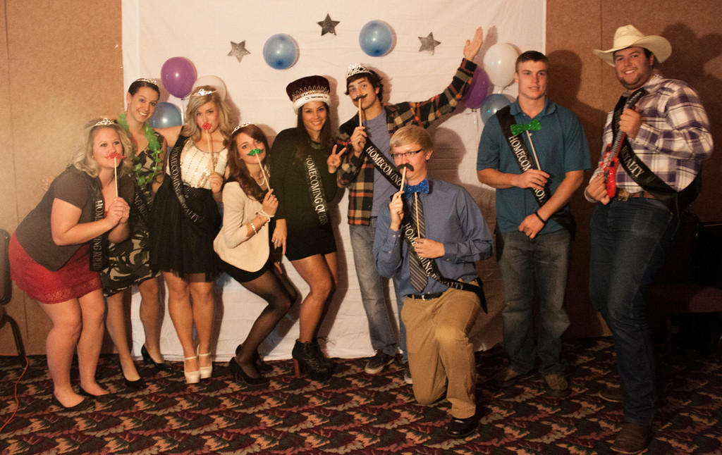 Chadron State College homecoming royalty pose at the 2013 Homecoming dance. From left, Kelli Johnson, Kalee Brewer, Justy Bullington, Kate Phelps, Apolonia Calleja, Jazz Bozner, Lane Swedberg, Glen Clinton and Kirby Krogman. (Miranda Wieczorek/ Chadron State College)