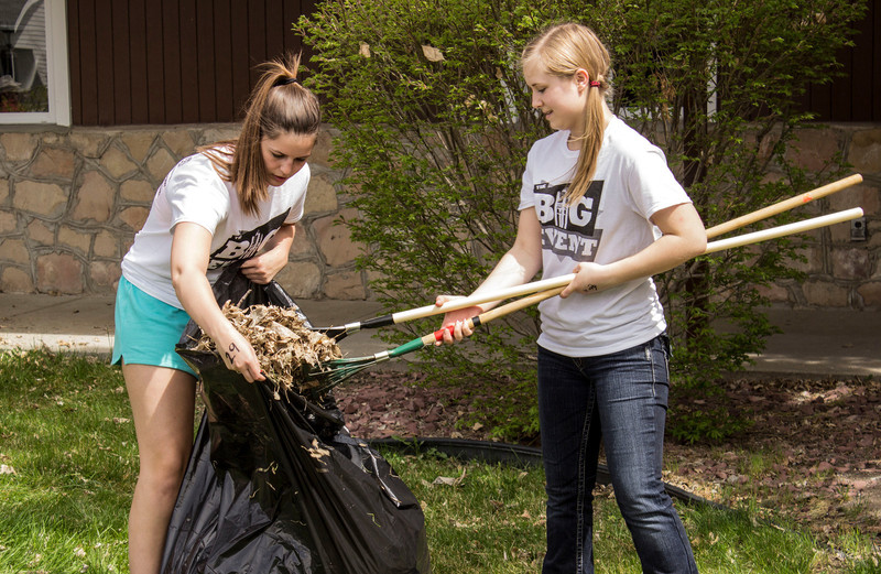 Volunteers rake leaves and help clean the grounds around the Grace Episcopal Church Saturday as part of The Big Event.