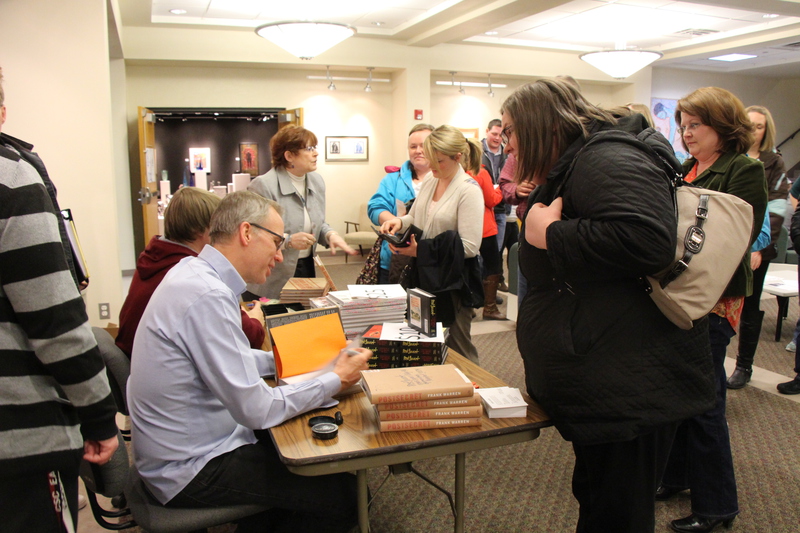 PostSecret fans visit with author Frank Warren during a book signing after his presentation in Memorial Hall Thursday night.