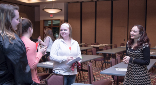 Maria Pascucci, right, speaks with Chadron State College students after her presentation Monday night in the Student Center Ballroom.