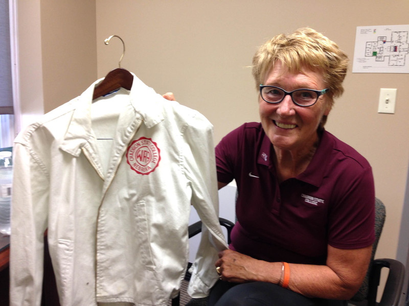 Dr. JoAnne Owens-Nauslar displays a jacket from her days as a Women's Recreation Association athlete.