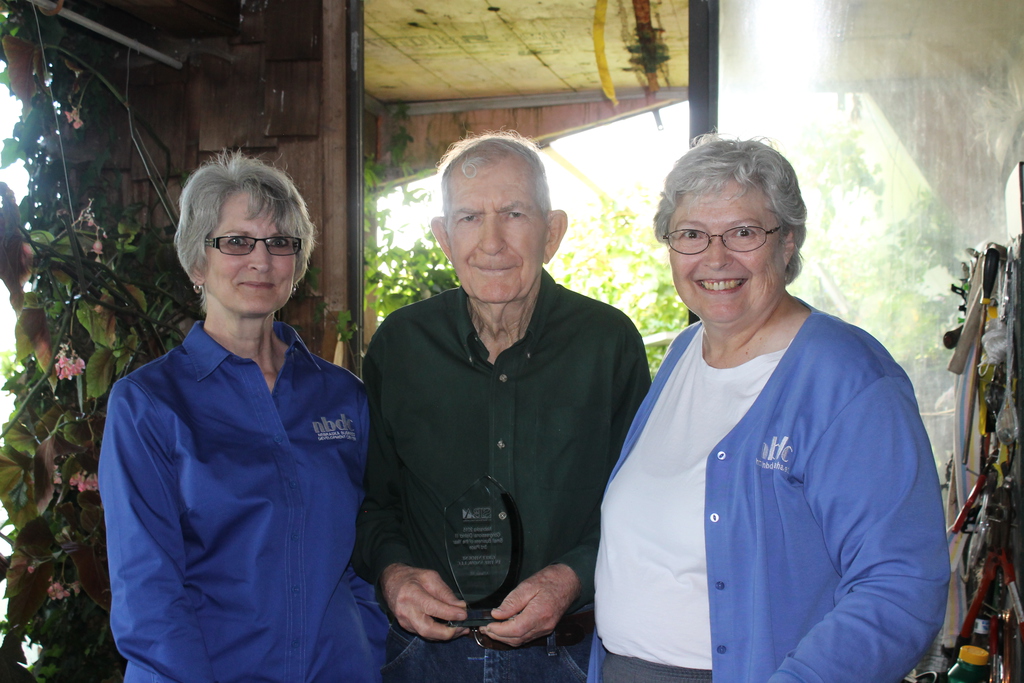 Joy Omelanuk, award recipient Russ Finch, and Jennifer Wittrock.