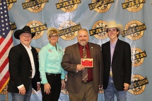 Jon Hansen accepts the Merit Award on behalf of the rodeo team