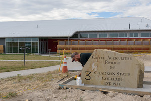 Steve Weber works on a stone marker