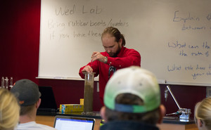 Anthony Perlinski instructs students in soil saturation