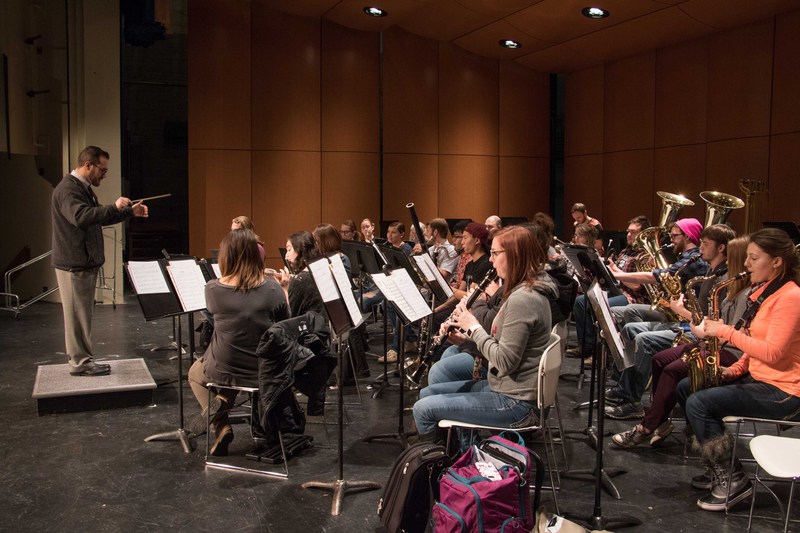 Dr. Sid Shuler, left, leads the Chadron State College Wind Symphony in practice in the new acoustical shell on the stage in Memorial Hall's Auditorium Wednesday, Feb. 1, 2017.