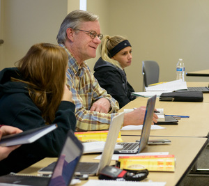 Dr. Brad Wilburn, professor of English and humanities, speaks during a philosophy class discussion at Chadron State College.