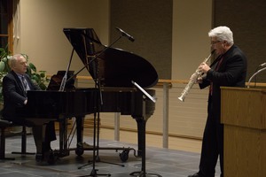 Dr. Jim Margetts, left, and Dr. Michael Stephens perform an original composition by Stephens Tuesday, Nov. 14, 2017, in the Sandoz Center Chicoine Atrium. The piece was commissioned by the Nebraska Music Teachers Association for their conference in October 2017.