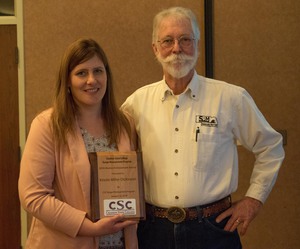 Kristin Miller poses after winning award