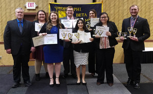 Phi Beta Lambda poses for picture after winning awards