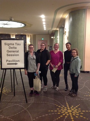 Five students pose after convention