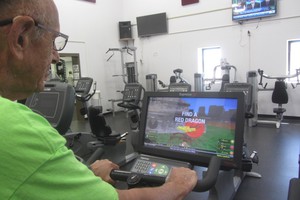 Marv Neuharth rides one of the Expresso Bike Machines in the NPAC