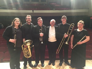 band members pose for photo after concert