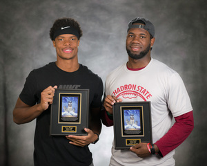 Trevon Wright and Louis Smith pose with Project Strive awards