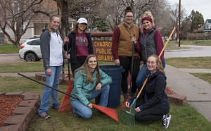 Eagle Dance Team pose after completing yard work