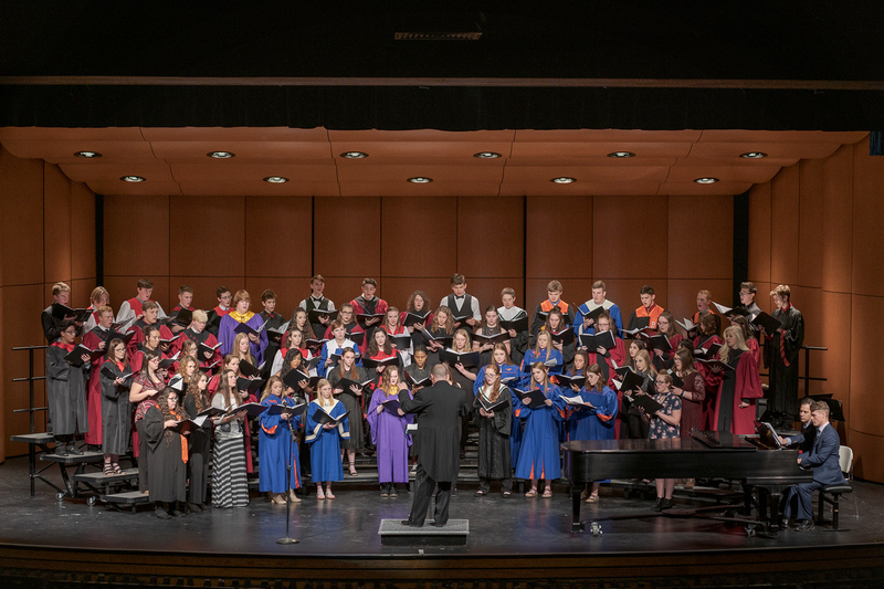 Dr. Joel Schreuder, professor of music, directs the High Plains Honor Choir, with Accompanist Bobby Pace, during the 2019 High Plains Band & Choir Festival on February 5. (Photo by Daniel Binkard/Chadron State College)