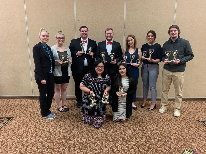 Chadron State College Phi Beta Lambda members pose with trophies following the Nebraska PBL competition in Kearney April 1-3, 2019