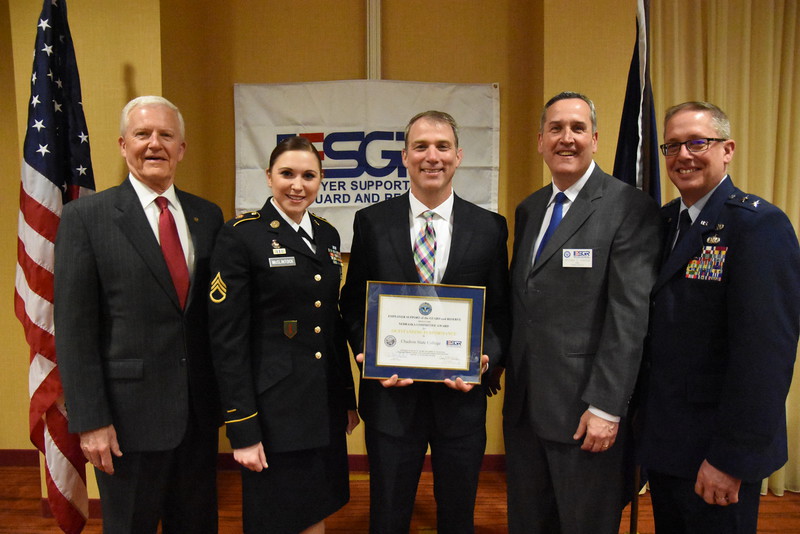 Chadron State College Admissions Representative and Staff Sgt. Heidi McClintock, second from left, and Nebraska State College System Chancellor Paul Turman, center, accept the Chair's Outstanding Performance Certificate at the Employer Support of the Guard and Reserve Awards Banquet in Lincoln April 26, 2019.