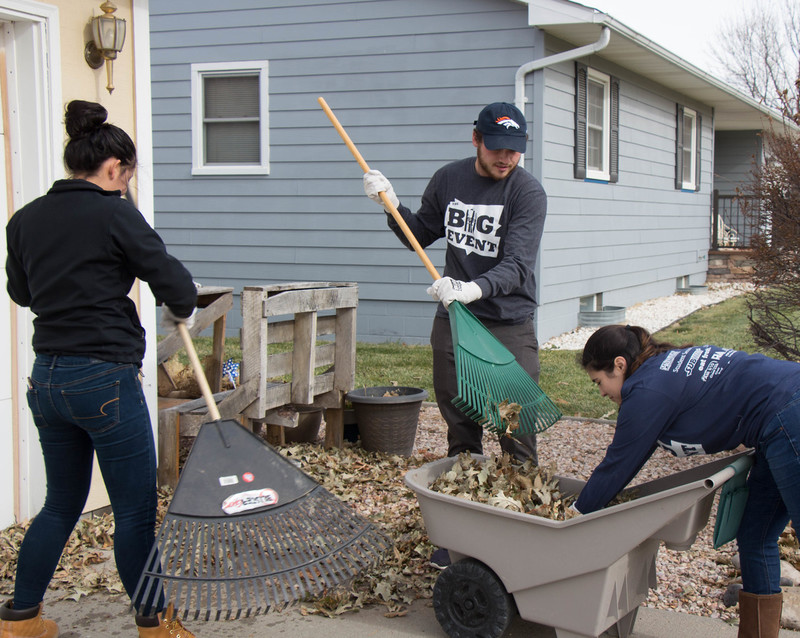 Chadron State College students, from left, Paola Rodriguez, Devin Fulton and Kyeisha Garza gather leaves at a Chadron residence during The Mini Big Event, Tuesday, Nov. 5, 2019.