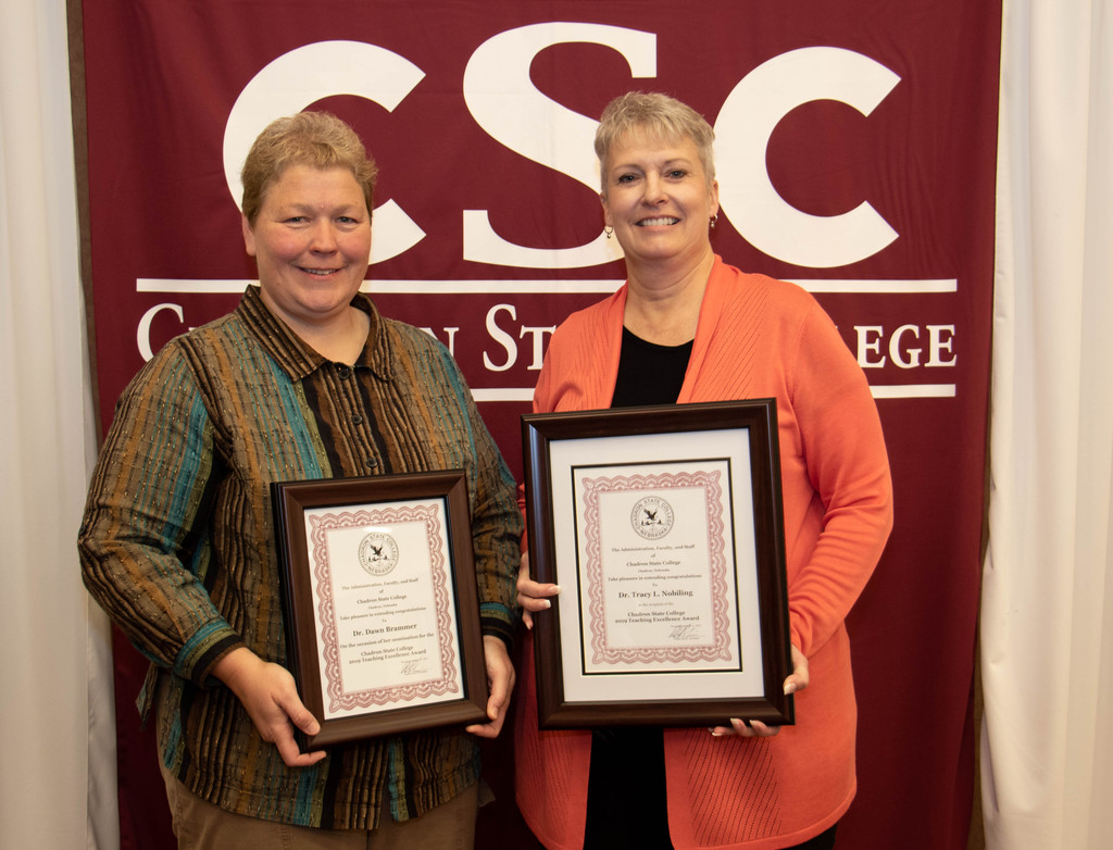 Chadron State College Teaching Excellence nominee Dr. Dawn Brammer, left, and CSC and Nebraska State College System Teaching Excellence Award winner Dr. Tracy Nobiling, right, pose at the annual Chadron State College recognition luncheon April 30, 2019, in the Student Center.