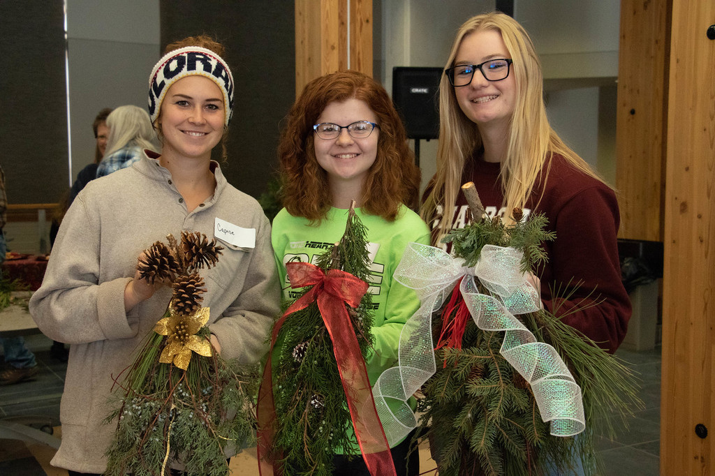 Chadron State College students poses at CSC's 9th annual greenery swag workshop led by Lucinda Mays in the Mari Sandoz High Plains Heritage Center Saturday, Nov. 17, 2018.