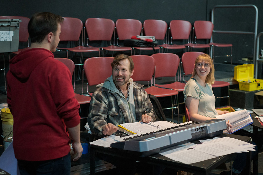 Coleton Bevins, left, speaks to David Craven, interim director of technical theatre, and student stage manager Taylor Thies during a rehearsal for 