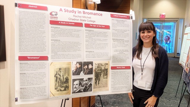 Chadron State College student Rachel Mitchell poses with her research poster about the bromance between Sherlock Holmes and John Watson at the North American Victorian Studies Association in Columbus, Ohio Oct 18, 2019.