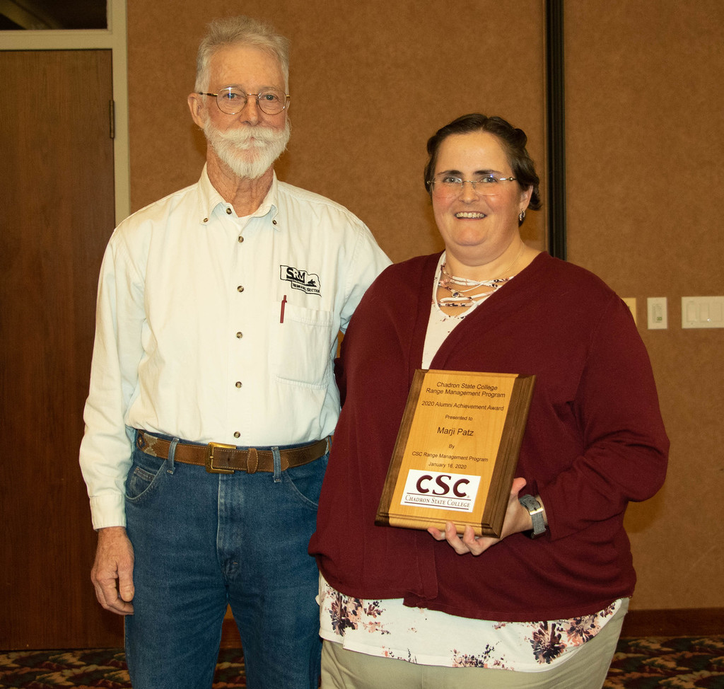 Chadron State College alumna Marji Patz received the college's Range Management Alumni Achievement Award from Dr. James O'Rouke