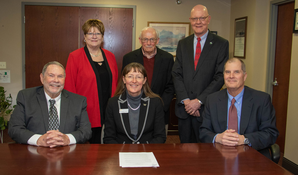 Officials of Chadron State College and Western Nebraska Community College pose at the signing of the Panhandle Advantage agreement