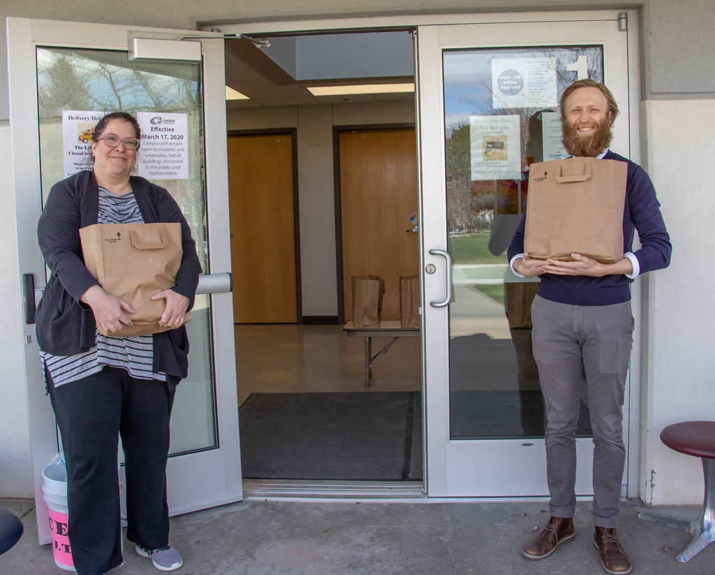 Christine Fullerton and Geoffrey Ledbetter, King Library employees, staff a pop-up food pantry